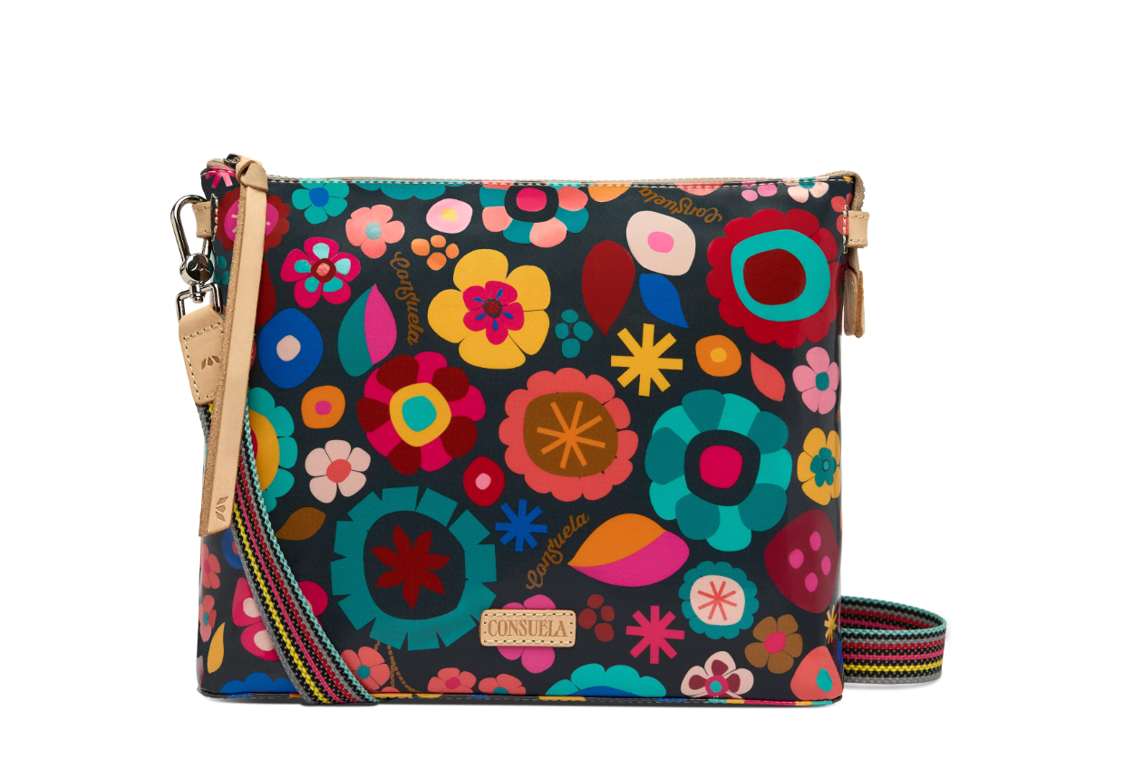 Colorful floral-patterned handbag with a strap on a white background
