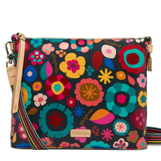 Colorful floral-patterned handbag with a strap on a white background