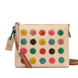 Beige handbag with colorful floral patterns on a white background