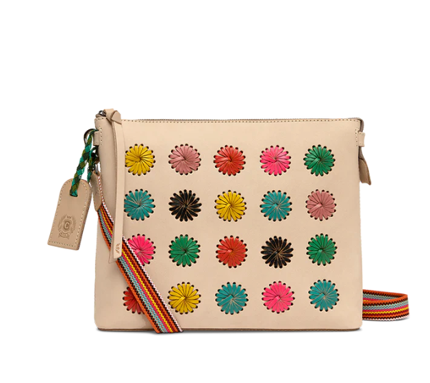 Beige handbag with colorful floral patterns on a white background