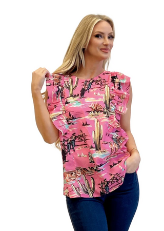 Woman wearing a pink sleeveless top with desert-themed print on a white background