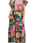 Woman wearing a colorful floral dress on a white background