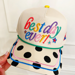 Cap with 'best day ever!' text in colorful letters on a white background