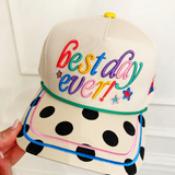 Cap with 'best day ever!' text in colorful letters on a white background