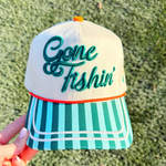 Cap with 'Gone Fishin' text on a textured green background