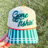 Cap with 'Gone Fishin' text on a textured green background