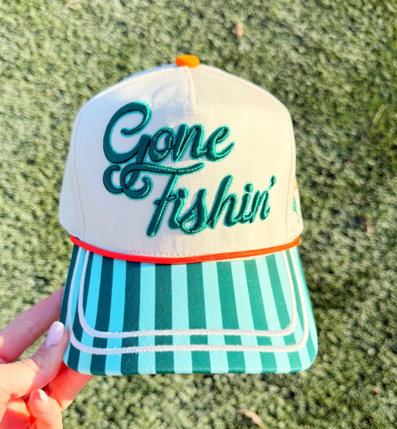 Cap with 'Gone Fishin' text on a textured green background