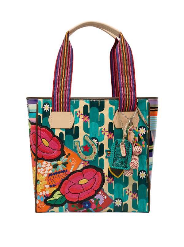 Colorful handbag with floral and cactus designs on a white background