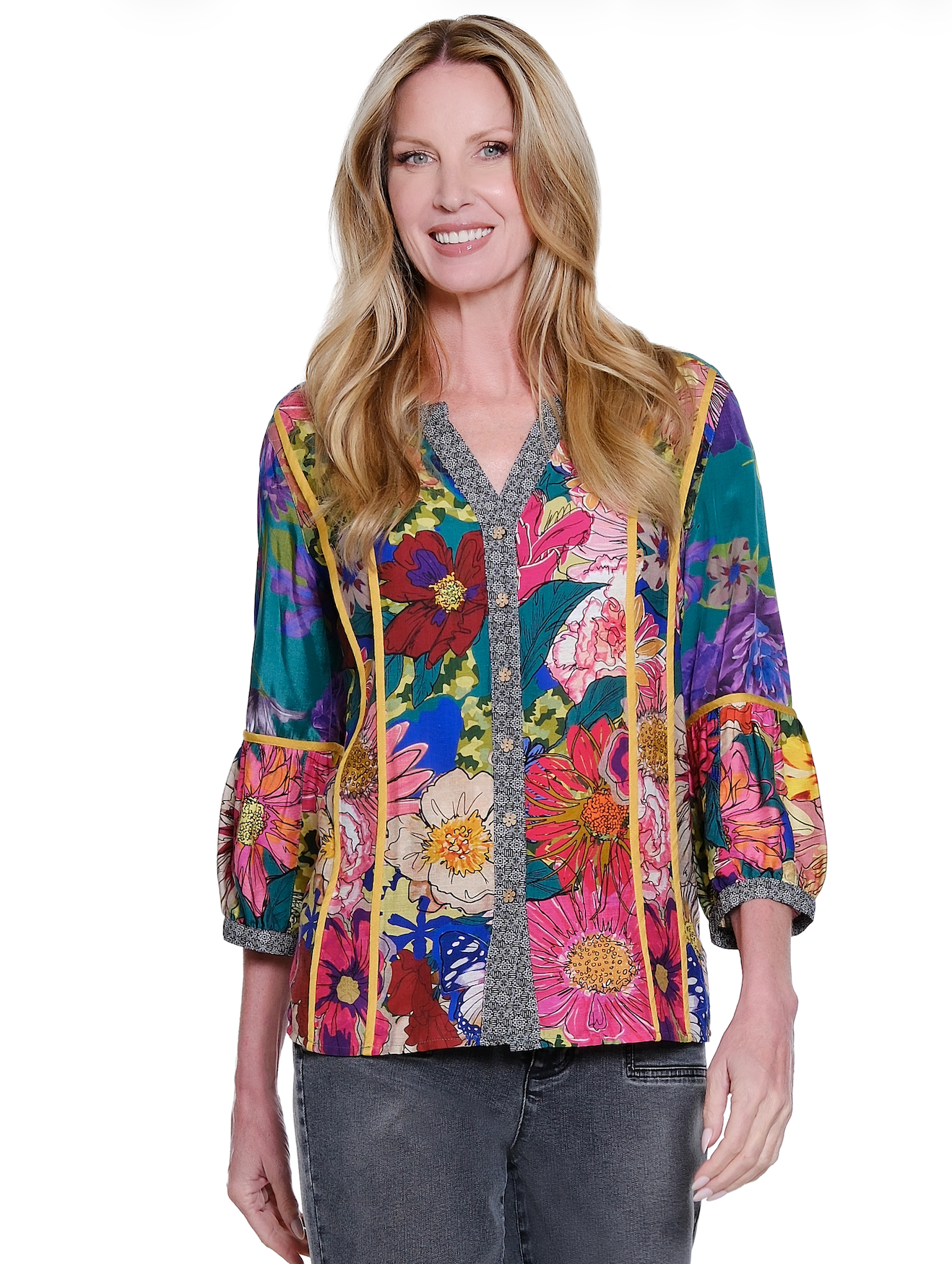Woman wearing a colorful floral jacket on a white background