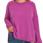 round next plum colored long sleeve top on model