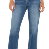 Blue jeans worn by a person on a white background