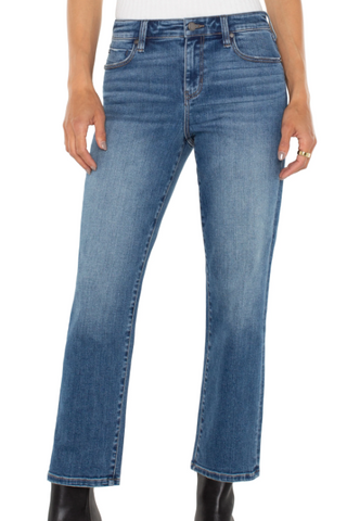Blue jeans worn by a person on a white background
