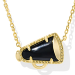 Gold necklace with a black pendant on a white background