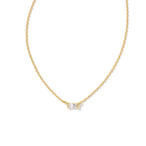 Gold necklace with a small diamond pendant on a white background