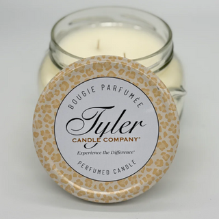 Tyler Candle Company candle with leopard print lid on a white background