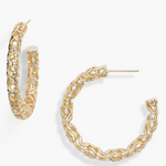 Gold hoop earrings on a white background