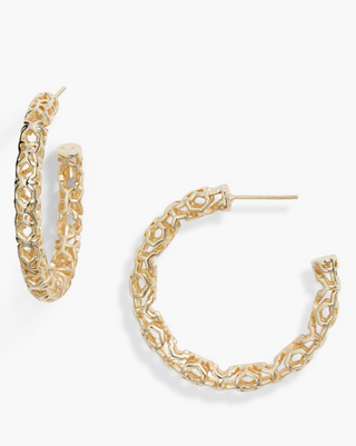 Gold hoop earrings on a white background