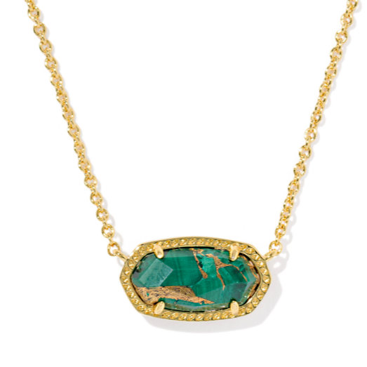 Gold necklace with a green stone pendant on a white background