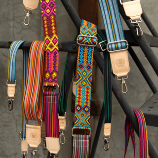 Colorful patterned straps hanging on a chair