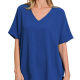 Woman wearing a blue t-shirt on a white background