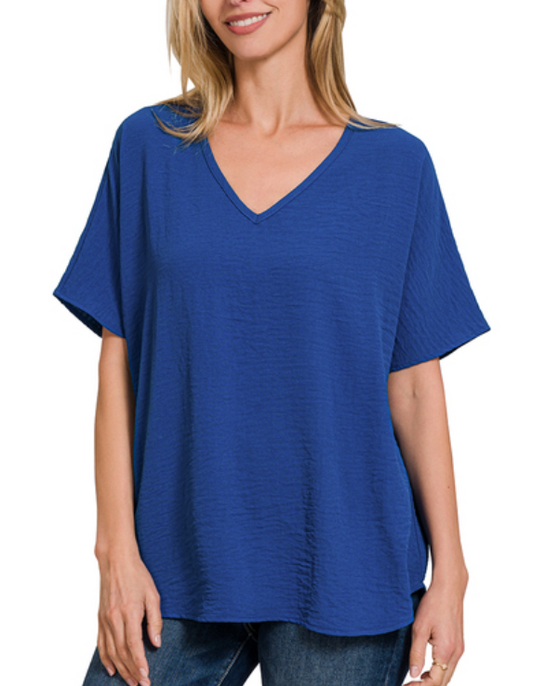 Woman wearing a blue t-shirt on a white background