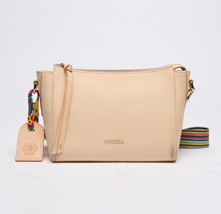 Beige handbag with a colorful strap and tag on a light gray background
