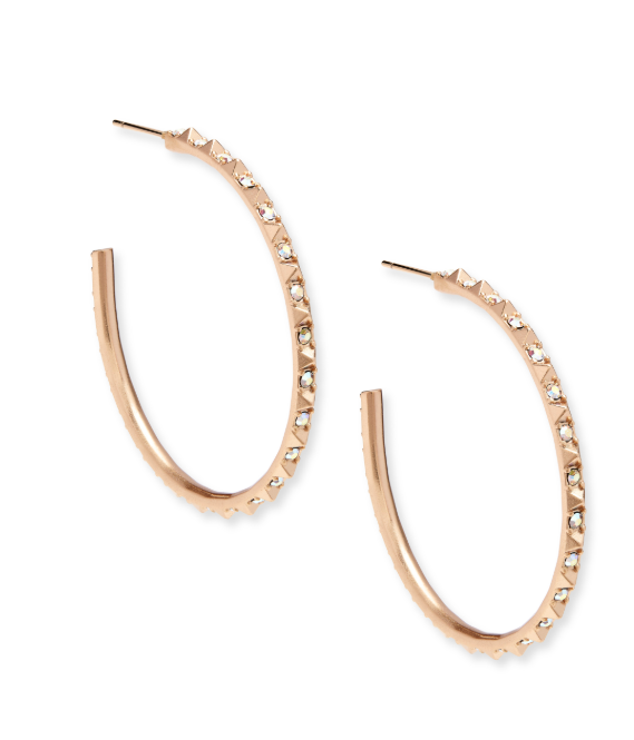 Rose gold hoop earrings with embedded stones on a white background