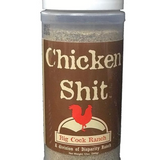 Container labeled 'Chicken Shit' from Big Cock Ranch on a white background