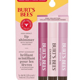 Burt's Bees lip shimmer packaging with three lip shimmers on a white background