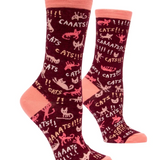 maroon socks with the word cats all over it.