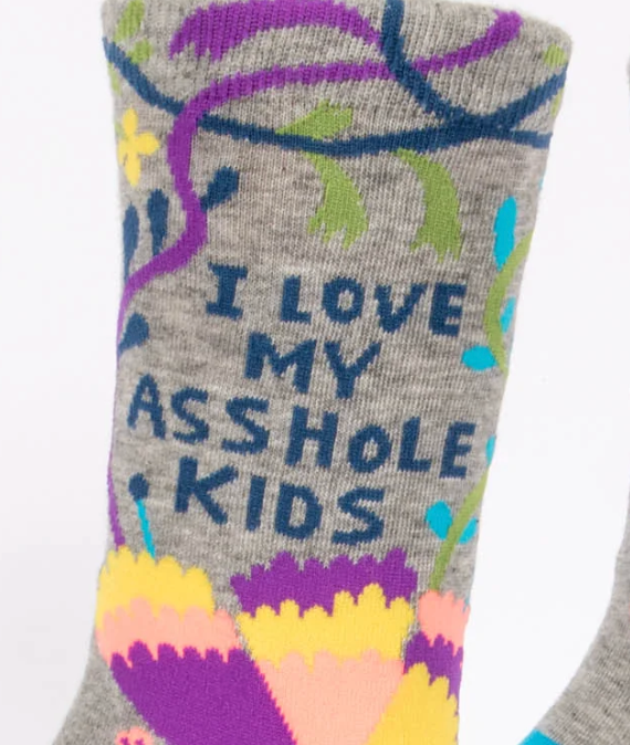Gray sock with colorful designs and text on a white background