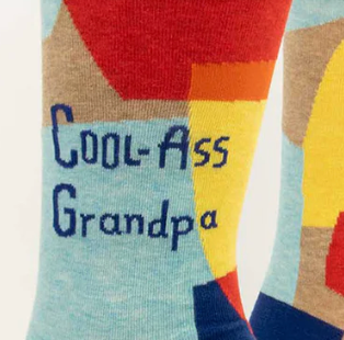 Colorful sock with 'Cool Ass Grandpa' text on a plain background