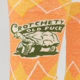 Socks with a graphic design featuring text and a bear on an orange background.
