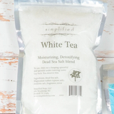 White tea packaging on a wooden surface