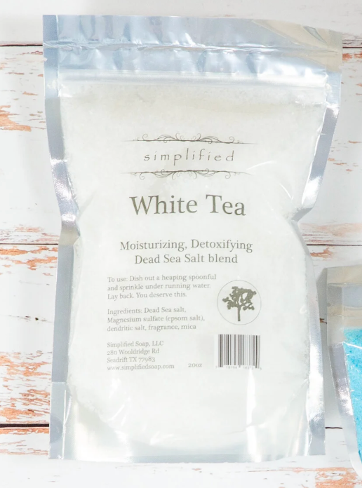 White tea packaging on a wooden surface