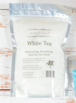 White tea packaging on a wooden surface