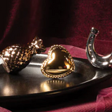 GOLD FIGURINES ON A BLACK TRAY