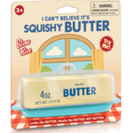 A novelty butter product in retail packaging. The package shows a pale yellow butter-like stick labeled 'BUTTER' and '4 oz.