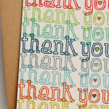 Colorful 'thank you' card on a white background