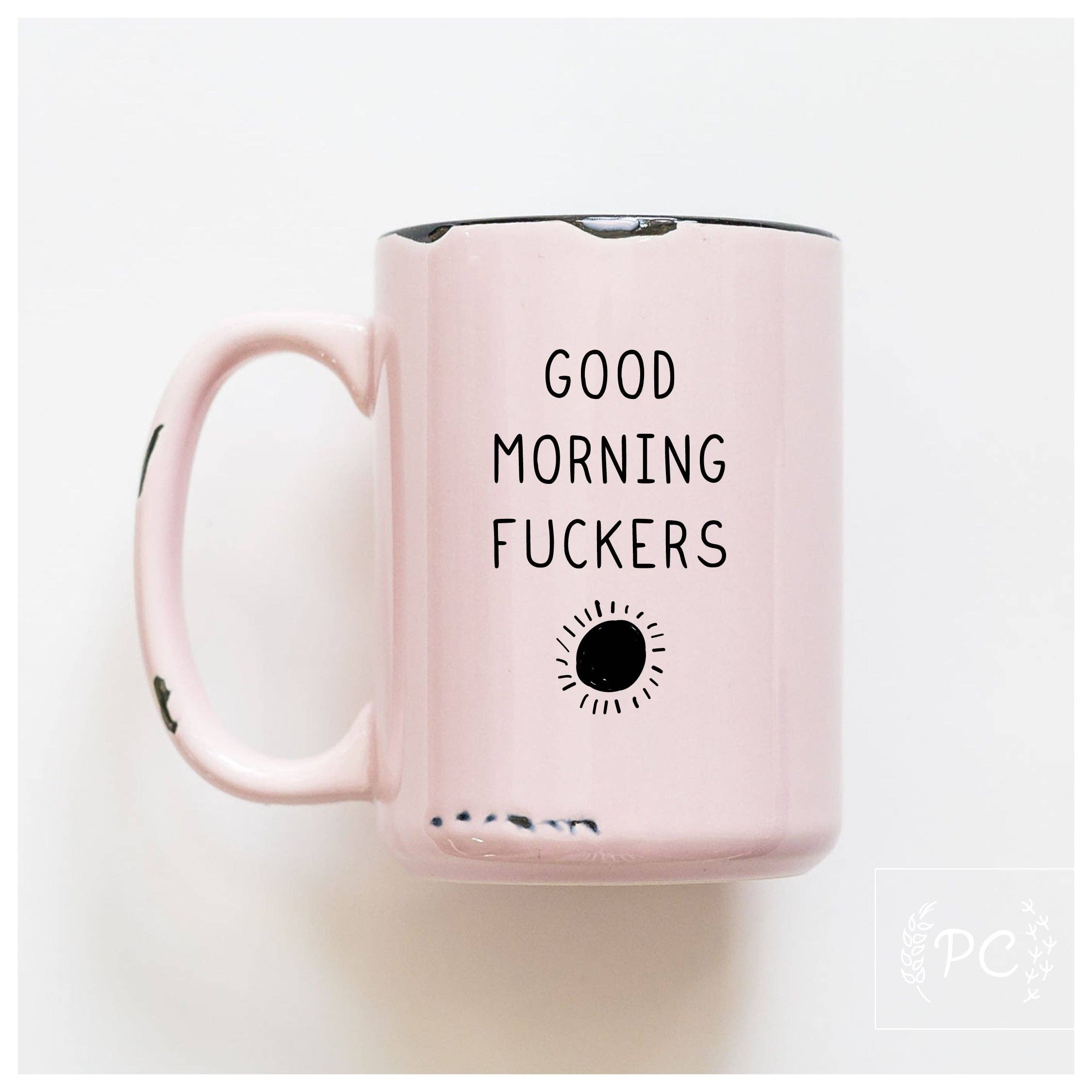 Pink mug with text 'Good Morning Fuckers' on a white background
