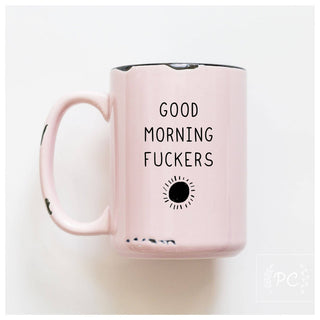 Pink mug with text 'Good Morning Fuckers' on a white background