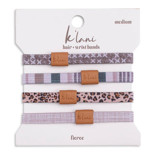Set of hair or wrist bands with leopard print and plaid patterns on a white background