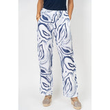 Person wearing blue and white patterned pants on a white background