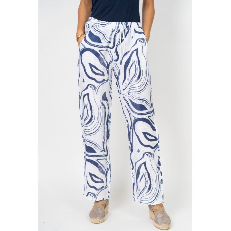 Person wearing blue and white patterned pants on a white background