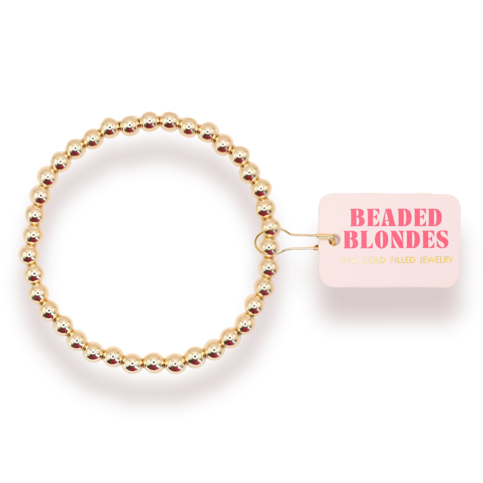 Gold beaded hair tie with 'Beaded Blondes' packaging on a white background