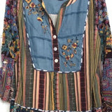 Colorful patterned jacket with floral embroidery on a hanger