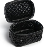 Black quilted makeup bag on a white background