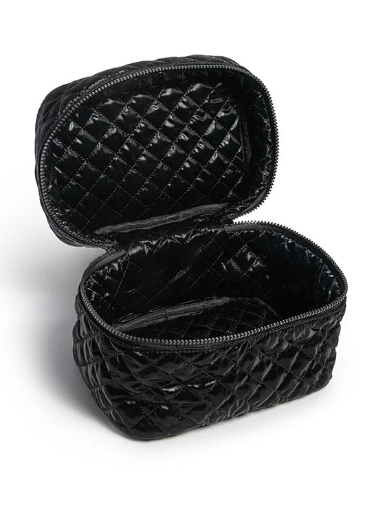 Black quilted makeup bag on a white background