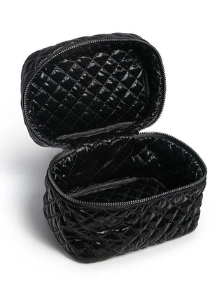 Black quilted makeup bag on a white background