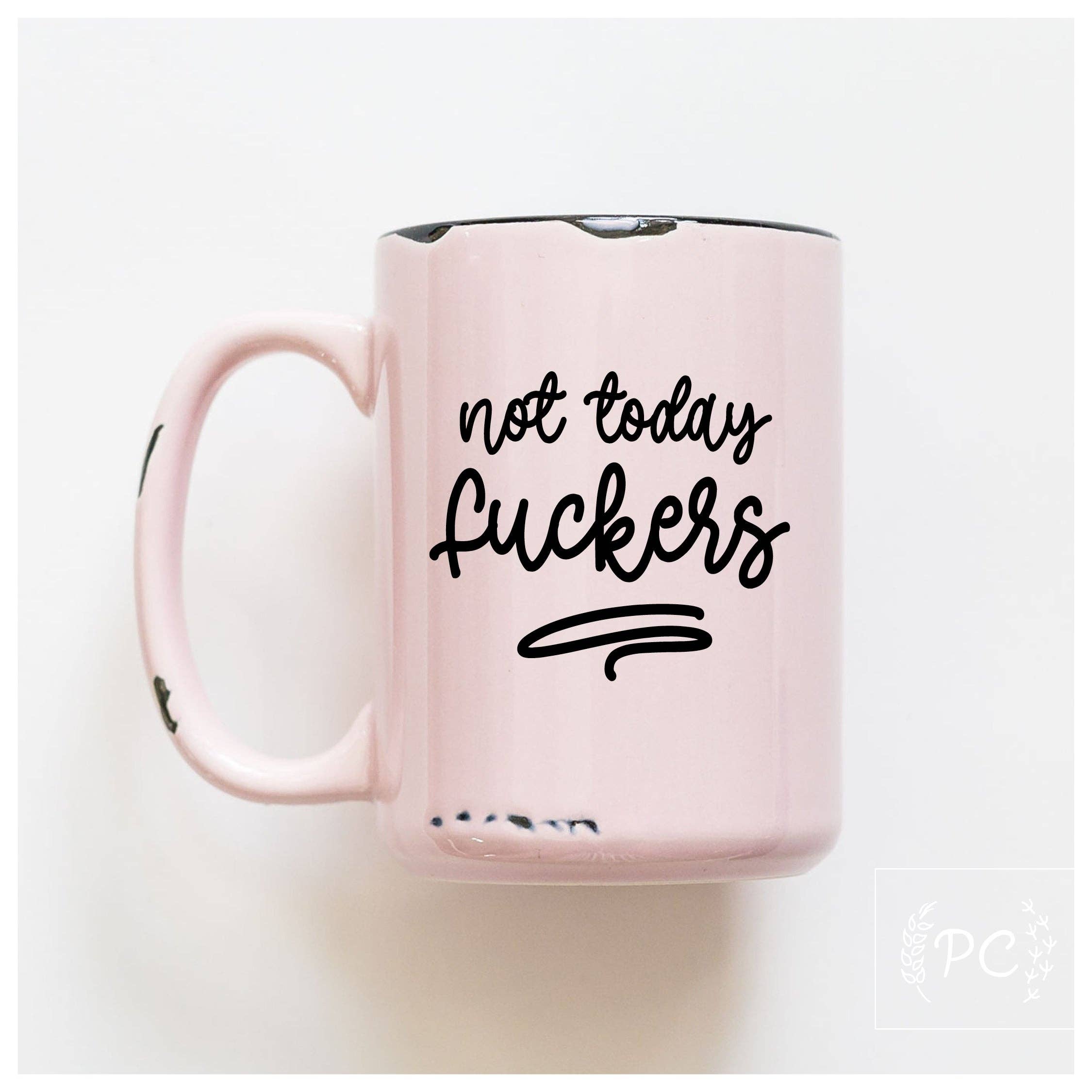 Pink mug with black text 'not today Fuckers' on a white background
